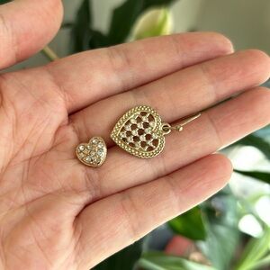 2 heart shaped loosely matching single earrings